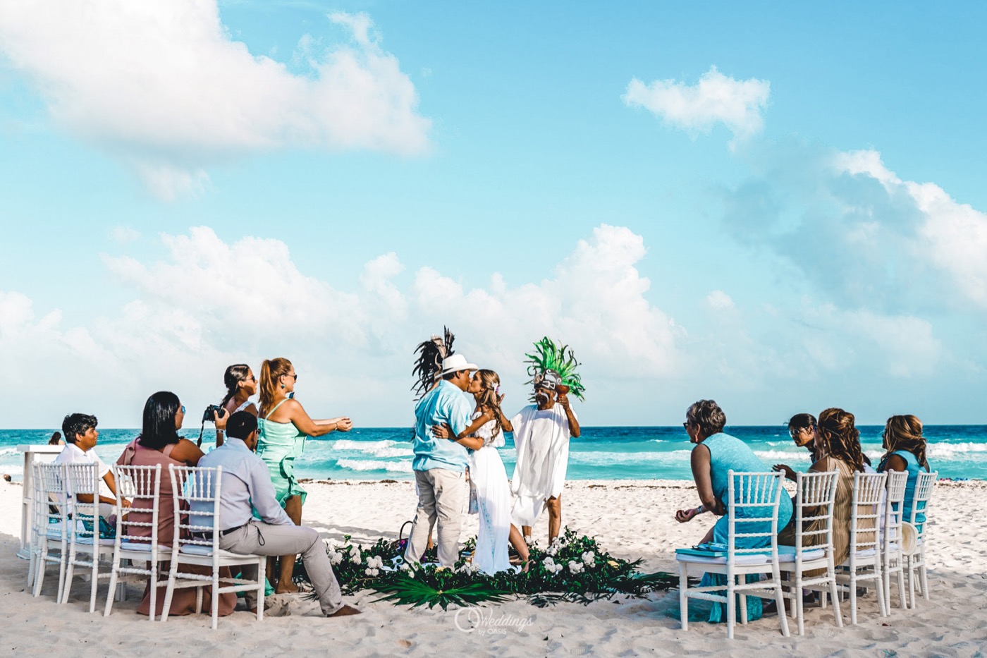 Terrace altar with red flower decoration and branches by the sea at the Grand Oasis Cancun Hotel