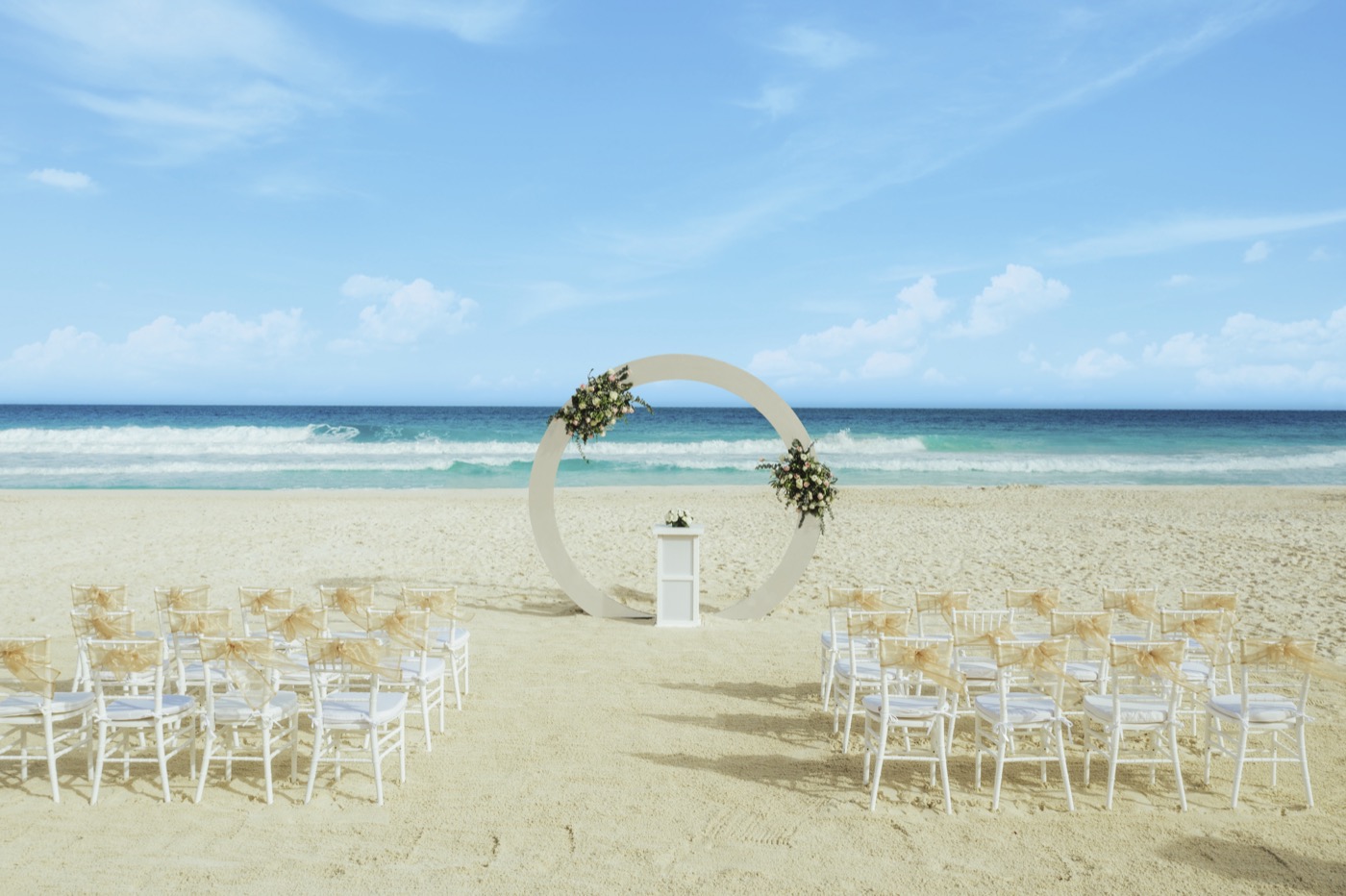 Terrace altar with red flower decoration and branches by the sea at the Grand Oasis Cancun Hotel