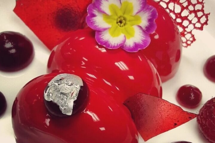 Raspberry mousse, berries semifreddo and silver leaf served in Careyes Restaurant at The Pyramid at 