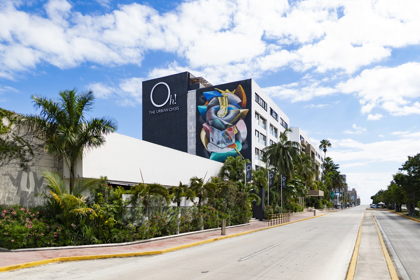 Couple of tourists in front of giant letters of Cancun